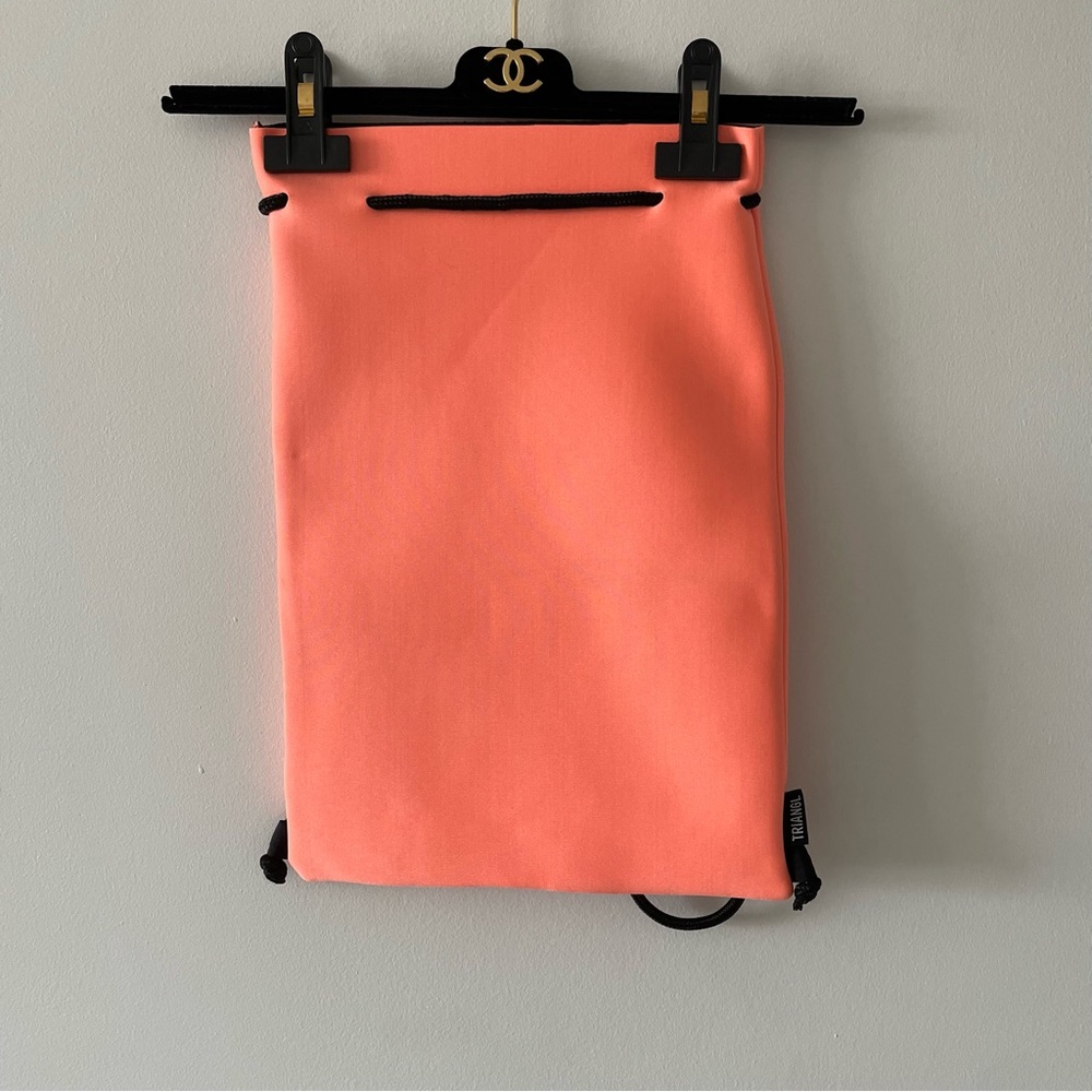 Triangl Swimwear neon orange neoprene drawstring backpack black straps